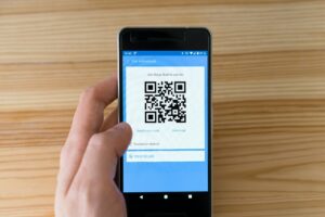 holding phone qr code